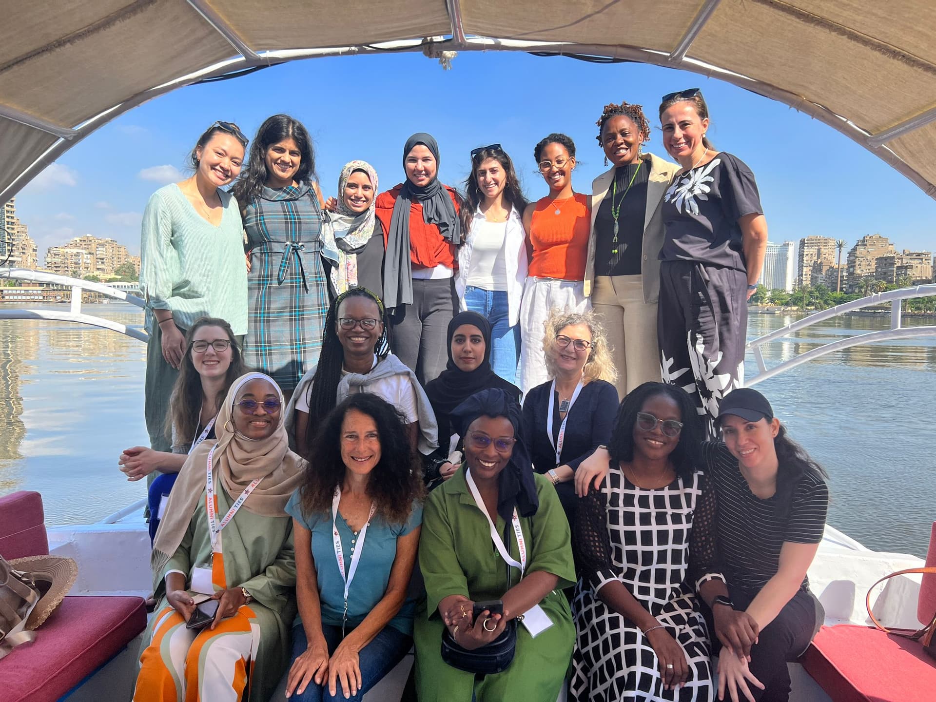 Selam at the Alumni TIES exchange seminar holding African Girls Can Code book